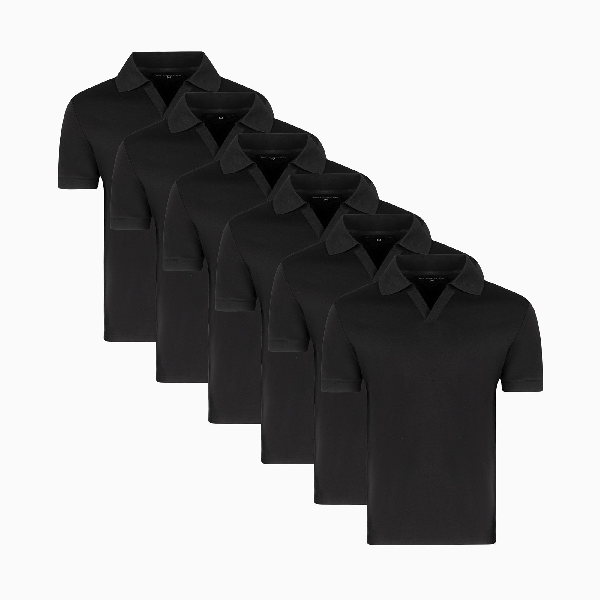 Three polo shirts in black, gray, and white are displayed side by side.