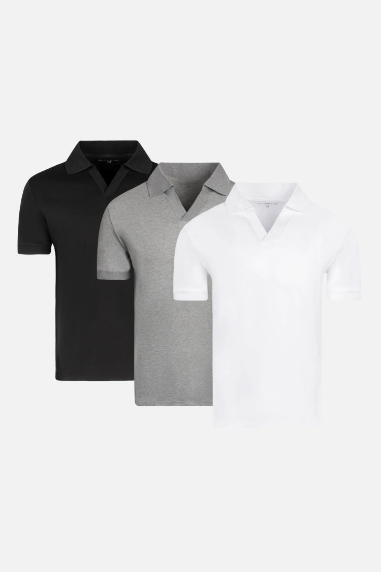 Three polo shirts in black, grey, and white arranged side by side.